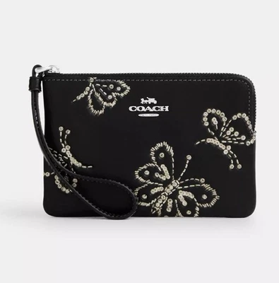 Muñequera Coach con cremallera en esquina con estampado de mariposa brillante CCJ72 plateada/negra nueva con etiquetas Foto 1 de 4