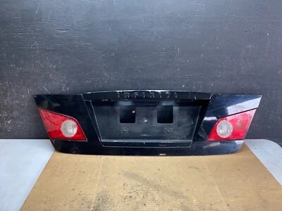 Infiniti M35 2006 2007 panel de maletero trasero moldura con luces OEM i7923 DG1 Foto 1 de 4