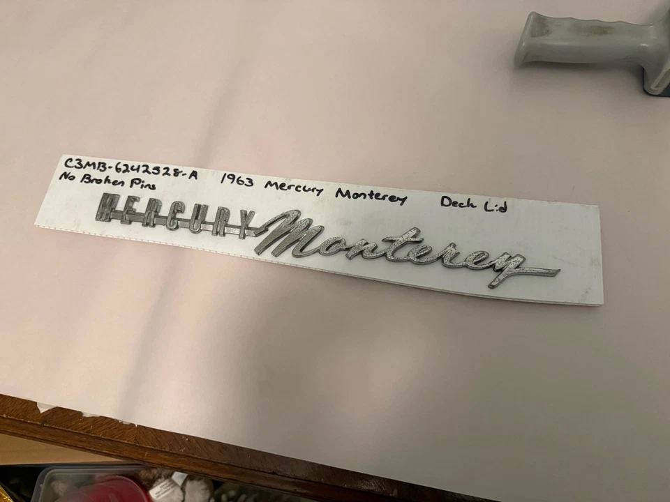 Mercury Monterey Monterey 1963 tapa maletero emblema cromo Foto 1 de 4
