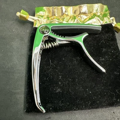 New Nice Metal Capo For Guitarist. Silver Color. New In Bag - Image 1 of 4