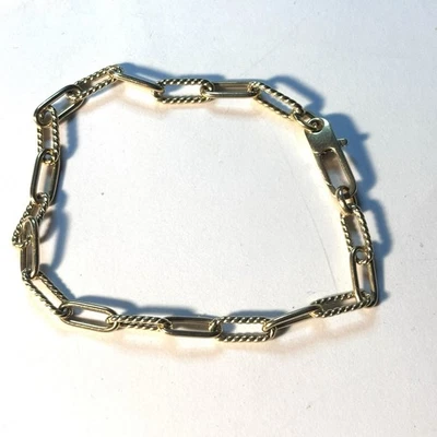 "Brazalete de eslabones con clip de oro amarillo de 18 quilates Roberto Coin con firma de rubí 7""" Foto 1 de 3