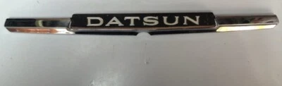 VINTAGE DATSUN 710 1973 To 1977 PLASTIC  / TRUNK EMBLEM - Image 1 of 3
