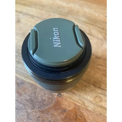 as-is Nikon 1 nikkor 30-110mm f/3.8-5.6 vr lens (Green) + front/back caps as-is - Image 1 of 4