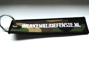 Llavero/Key-ring WERKEBIJDEFENSIE.NL aprox 13x3 cm en camuflaje - Imagen 1 de 1
