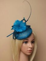 Kingfisher blue fascinator with feather flowers and quill on aliceband. 