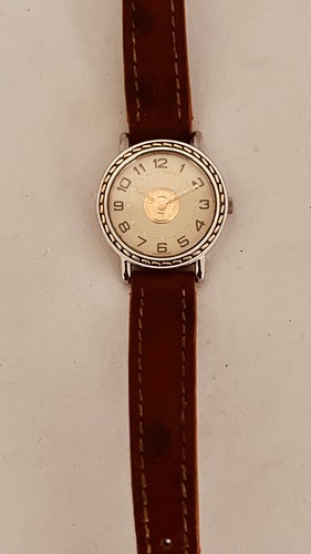 Montre Hermès Sellier Or et acier