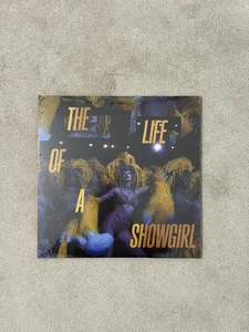 Taylor Swift - THE LIFE OF A SHOWGIRL Baby That’s Show Business Golden Vinyl - Picture 1 of 3