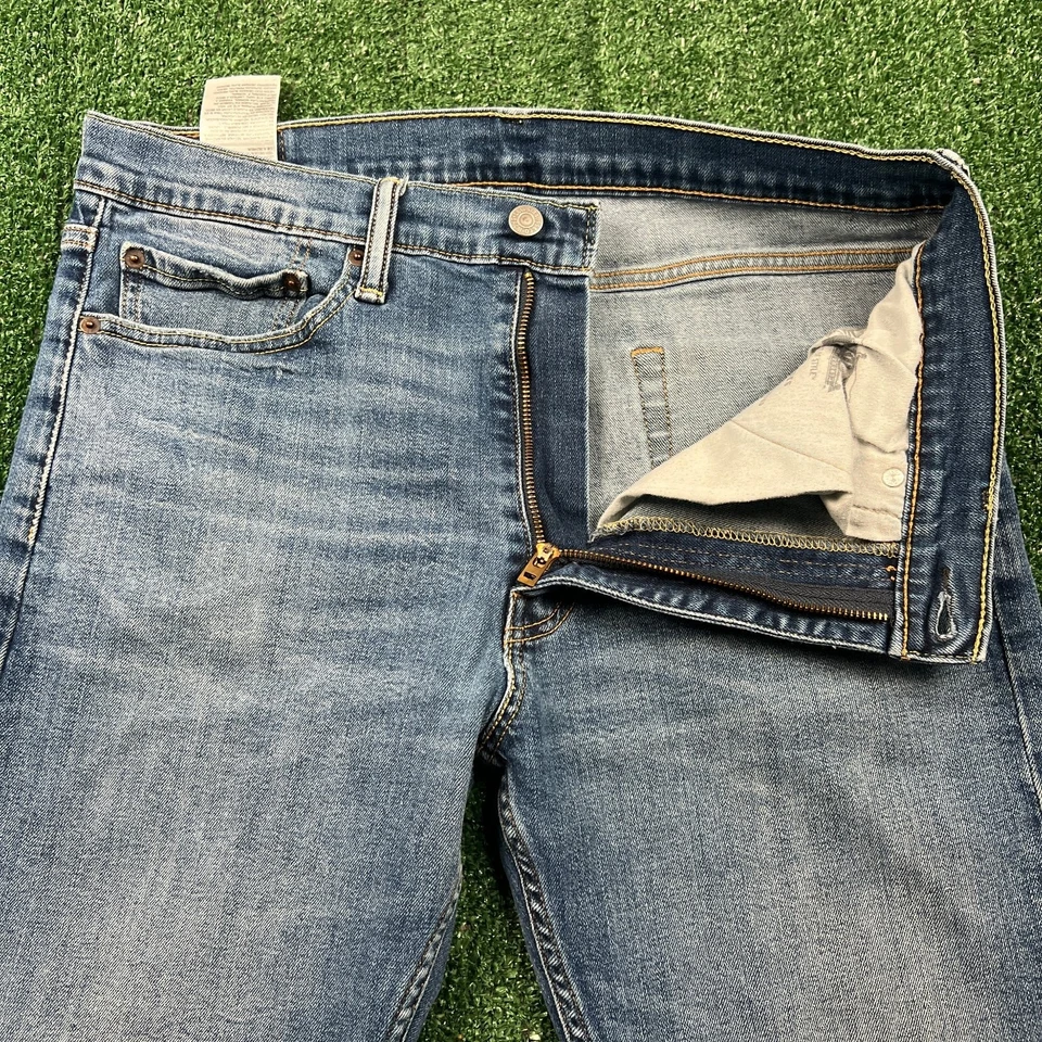 Jeans Levi's 513 ajustados rectos con cremallera lengüeta roja para hombre 33x30" azul lavado medio Foto 1 de 4