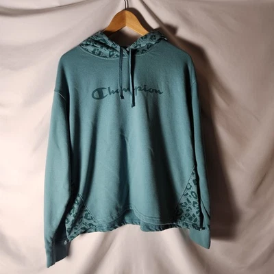 Champion L/G Sudadera con Capucha Tejido Inverso Aqua Teal Estampado Floral/Leopardo Foto 1 de 4