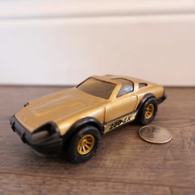 VINTAGE BUDDY L DATSUN 280-ZX GOLD AND BLACK 5" LONG - Image 1 of 3