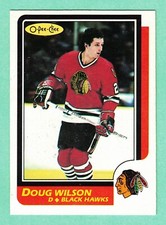 (1) DOUG WILSON  1986-87 O-PEE-CHEE # 106 HAWKS  EX-MT CARD (I7175)