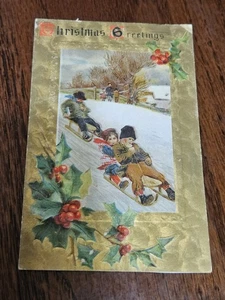 Vintage 1908 Christmas Postcard Cute Children Sledding Down Hill Gold Face NICE - Picture 1 of 2