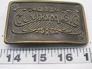 OLD COUNTRY MUSIC BELT BUCKLE CLOTHING ADVERTISING - Picture 1 of 2