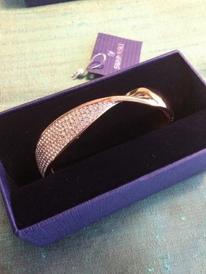 Stunning Signed Swarovski  TWIST Rose Gold Bracelet, Size M, Boxed - Image 1 of 4