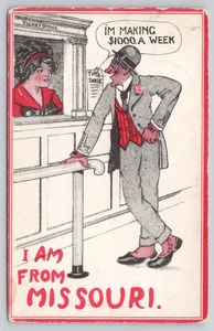 I Am From Missouri Man Talking to Lady at Ticket Booth Comic 1912 Postcard - Picture 1 of 2