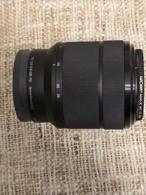 Sony FE 28-70mm f3.5-5.6 OSS Lens for Sony E Mount Full Frame W/OEM Lens Hood - Image 1 of 4