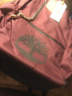 Timberland bookbag style# A2J1S601 Burgandy in color emblem on front pocket