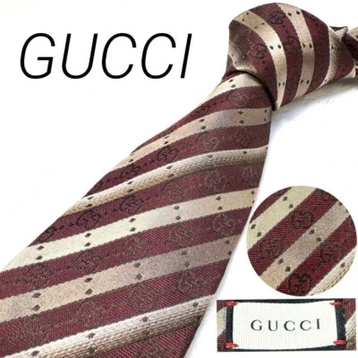 Cravatta Gucci nuova mai usata a righe bordeaux rosso argento 100% seta Made ... - Immagine 1 di 4