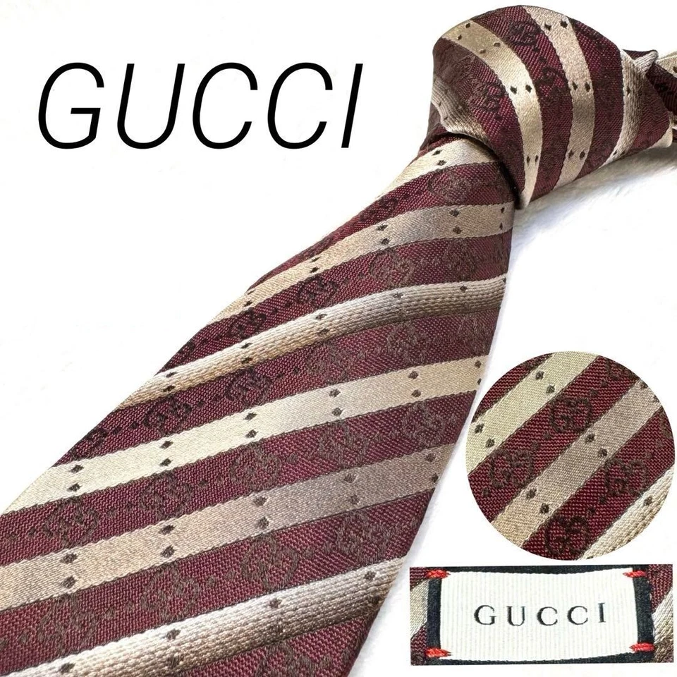 Cravatta Gucci nuova mai usata a righe bordeaux rosso argento 100% seta Made ... - Immagine 1 di 4