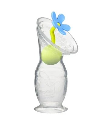 Extractor de leche de silicona Haakaa con base de succión y tapón de flores azules Foto 1 de 4