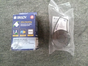 110930 M21-500-427 Brady (2pk) Black on Trans/White Vinyl 1.5" x 14' Cartridges - Picture 1 of 2