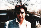 Elvis Presley poses for a portrait in the day time outside in 19 - 1956 Photo