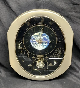 SMALL WORLD RHYTHM COSMOS MELODIES WALL CLOCK ROTATES MOTION - Picture 1 of 12