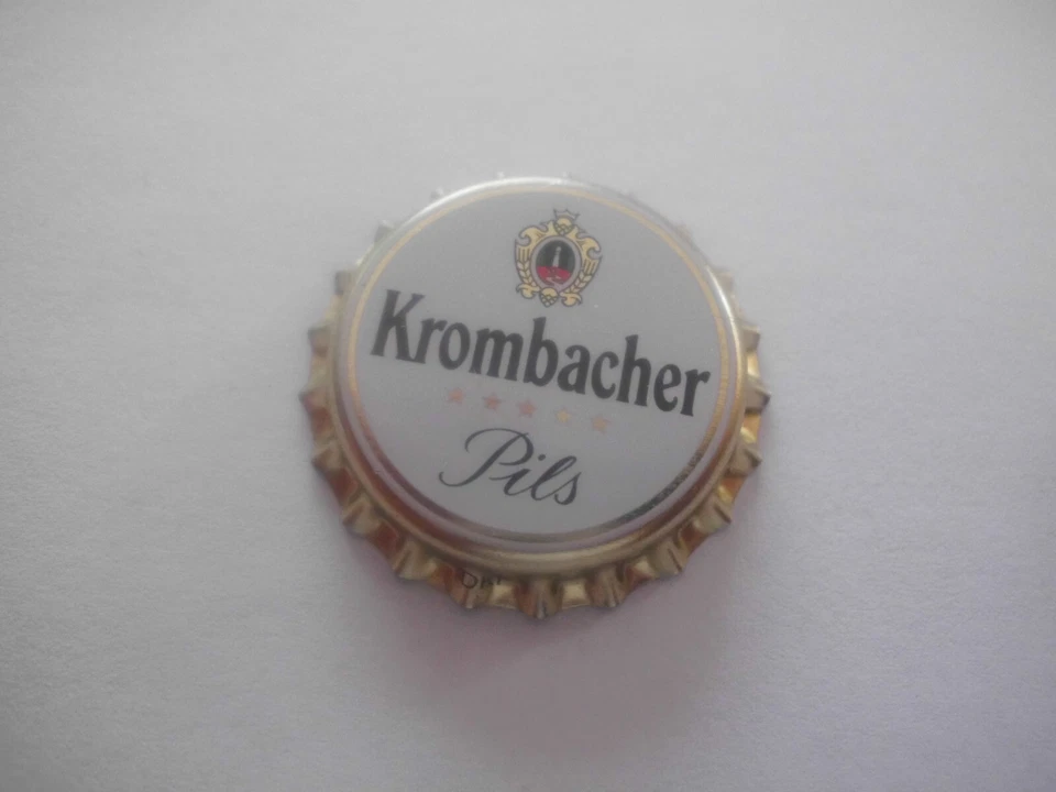 Unbenutzter, gold-weisser Kronkorken Krombacher Pils (mit Sternen, ohne Linien) - Bild 1 von 1