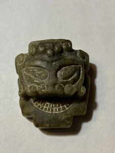 VARIEGATED CALEDON , BLACK AND BROWN JADE PENDANT OF A HUMAN FACE. SHANG DYNASTY - Picture 1 of 6