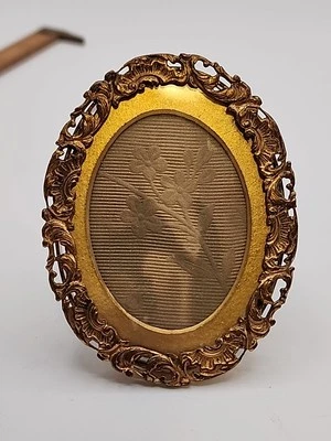 Antiguo marco de fotos de latón Marshall Fields & Co Chicago 3,5" ovalado con vidrio Foto 1 de 4