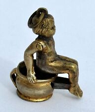Antique Brass Cigar Cutter Fob Lady Sitting on Potty / Chamber Pot