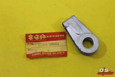 AJUSTADOR DE CADENA SUZUKI RM100 RM125 TM100 TS185 TM125 TS100 RV125 OEM #61410-28004 Foto 1 de 4