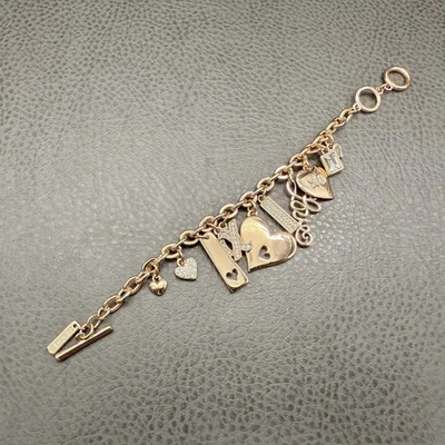 White House Black Market Charm Bracelet Gold Tone Hearts XO Crystal Love Toggle - Image 1 of 4