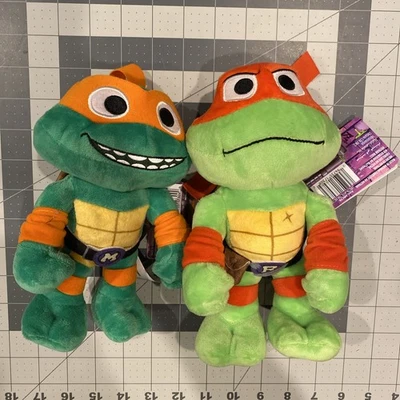 TMNT Teenage Mutant Ninja Turtles Mutant Mayhem 8” Plush Raphael & Michelangelo - Image 1 of 4