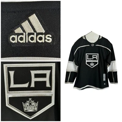Camiseta deportiva de hockey Adidas NHL Los Angeles Kings auténtica profesional negra para hombre talla 52 L Foto 1 de 4