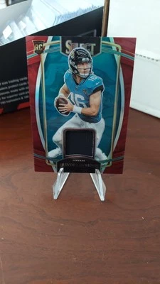 2021 Panini Select - Rookie Swatches Trevor Lawrence #RSW-TLR Red Prizm  - Image 1 of 2