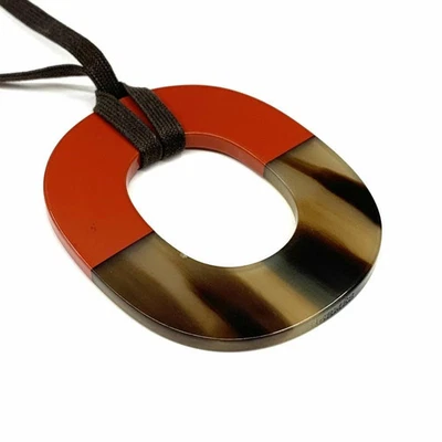 Colgante Hermès Cuerno de Búfalo Ismus Naranja y Marrón Usado Foto 1 de 4