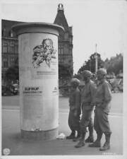 Tank crew members reading a German sign, following German retreat  Old Photo