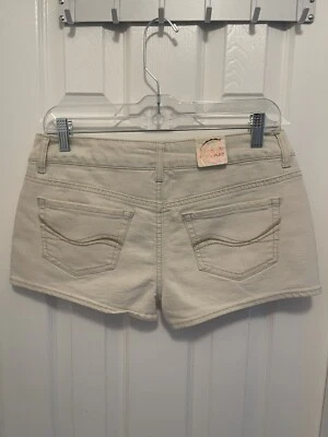 SHORTIE VAQUERO LAVADO TAN LIGERO BASE 5 BOLSILLOS TALLA 7 CINTURA VAQUERA 31" MUJER SHORTS NUEVO Foto 1 de 4