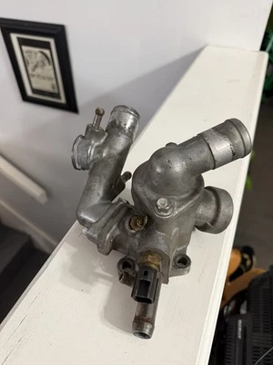 1995-1999 Mitsubishi Eclipse coolant thermostat housing assembly 4G63T - Image 1 of 4