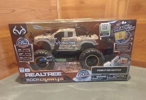 NUEVO EN CAJA REALTREE FORD F-150 RAPTOR ROCK CRAWLER CON BATERÍA RECARGABLE Y CARGADOR - Imagen 1 de 17