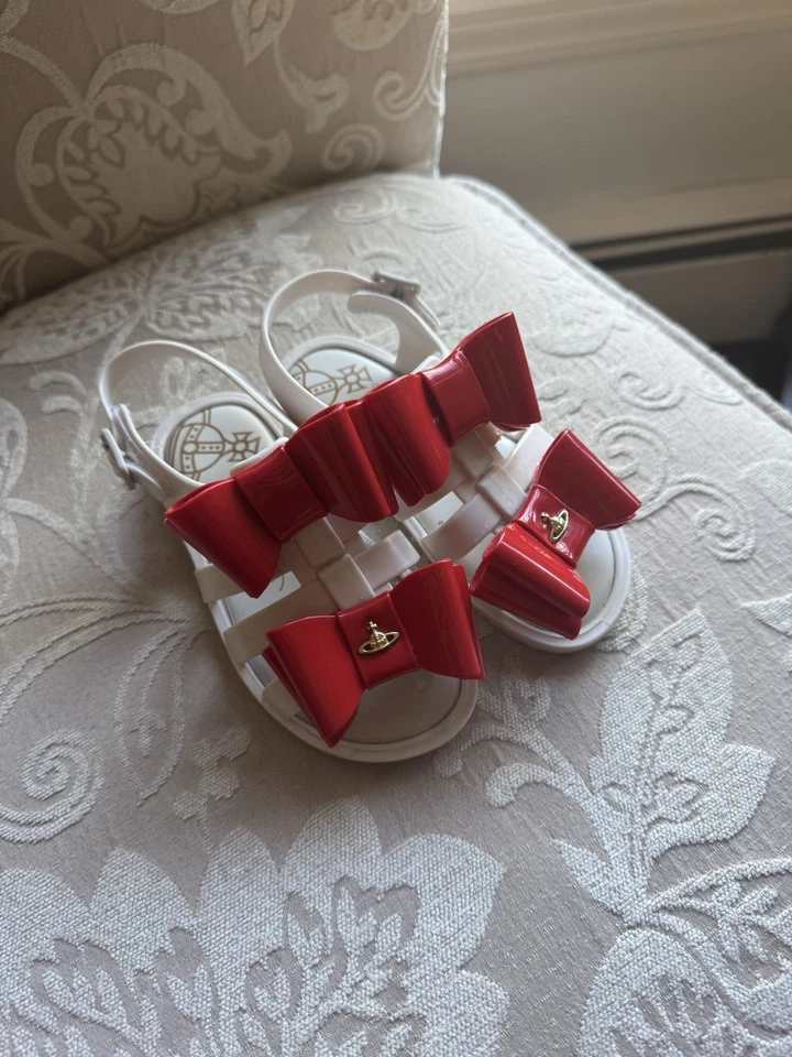 Vivienne Westwood x Mini Melissa Zapatos de Jalea Blanca con Arcos Rojos Niño Pequeño 9 Foto 1 de 4