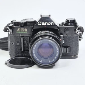 Black Canon AE-1 Program 35mm Manual SLR Film Camera with 50mm 1:1.8 Lens - Picture 1 of 19