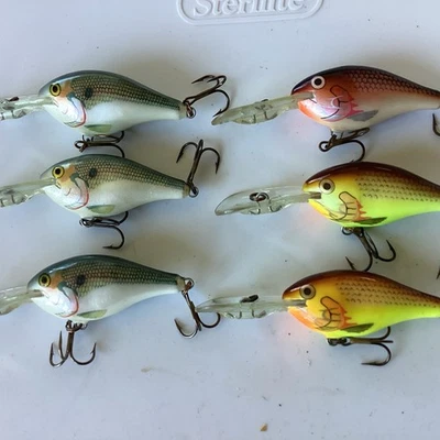 #62  Six (6) Rapala Risto Raps, RR-5:  3-Shad, 2-Hot Mustard & 1-Plum Color - Image 1 of 4