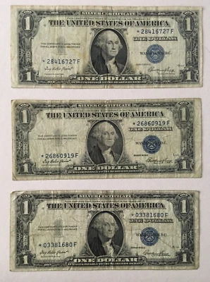 A lot of three 1935 E Silver Certificate Star notes circulated $1.00 bill - Image 1 of 2