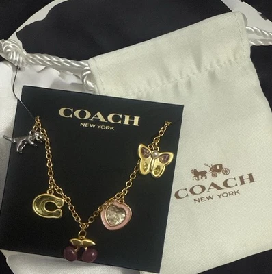NUEVO CON ETIQUETAS Pulsera Coach Charm Larga Esmalte Circonita Cúbica Tono Dorado Joyería Foto 1 de 3