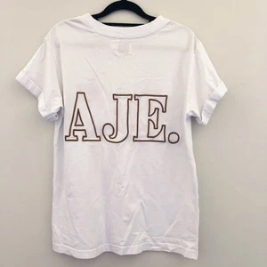 Camiseta Aje Grande Espalda Logo Mujer Top Blanco Talla XS PRECIO DE VENTA SUGERIDO POR EL FABRICANTE $ 195 - Imagen 1 de 9