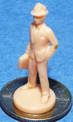 Very Small HO Scale Plastic Figure of a Business Man with a Breif Case - Image 1 of 3