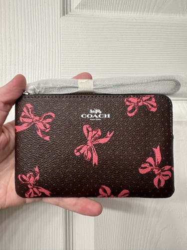 Coach Polsino in pelle con zip angolare Merlot con stampa fiocco rosa nuovo con etichetta CZ441