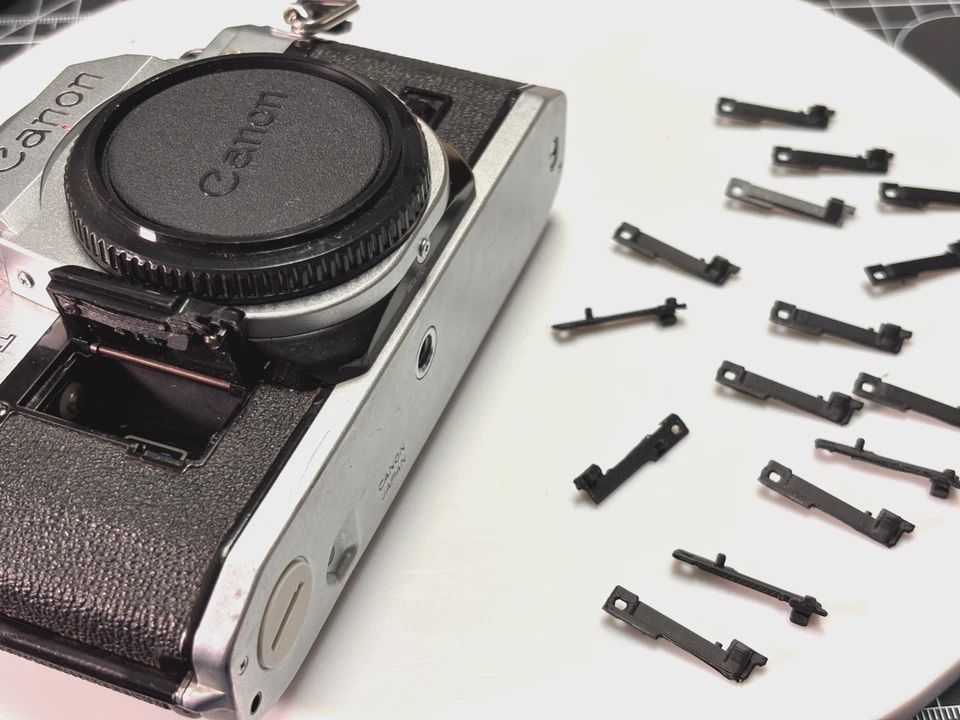 Genérico Canon AE-1, Programa AE-1 y Pestillo de puerta de batería A-1 - Nuevo [PROBADO para ajuste] Foto 1 de 4